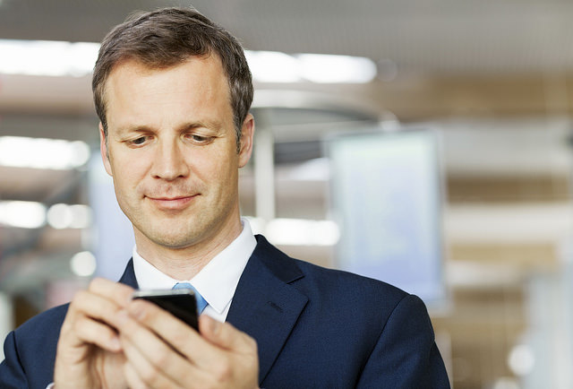 Business man conducting a mobile search